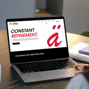woman looking at website redesign on a laptop
