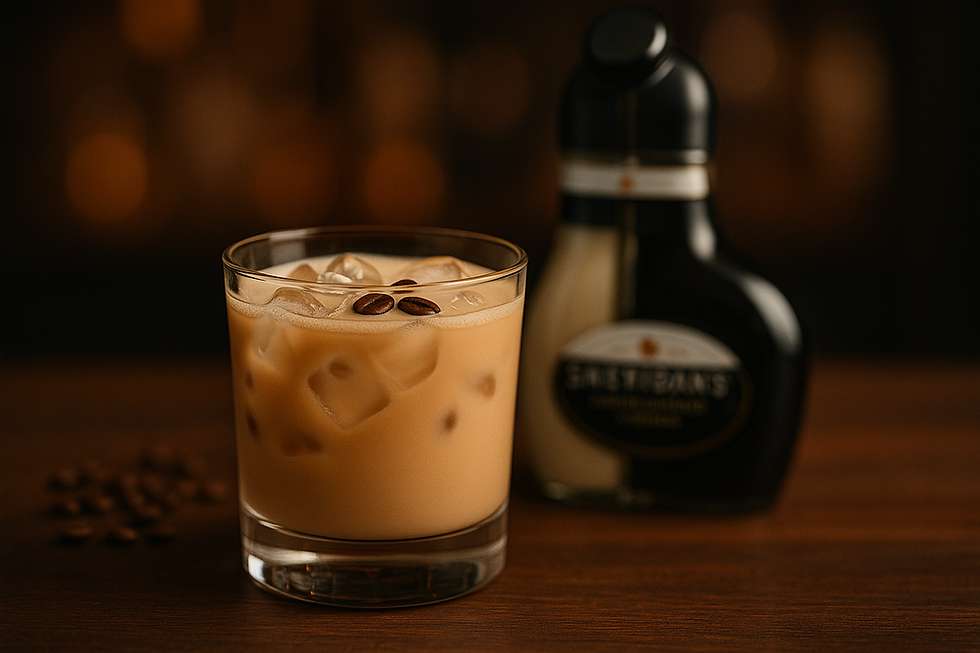 Sheridan’s White Russian cocktail in a rocks glass with ice, cream floating over coffee liqueur, and Sheridan’s bottle beside it.
