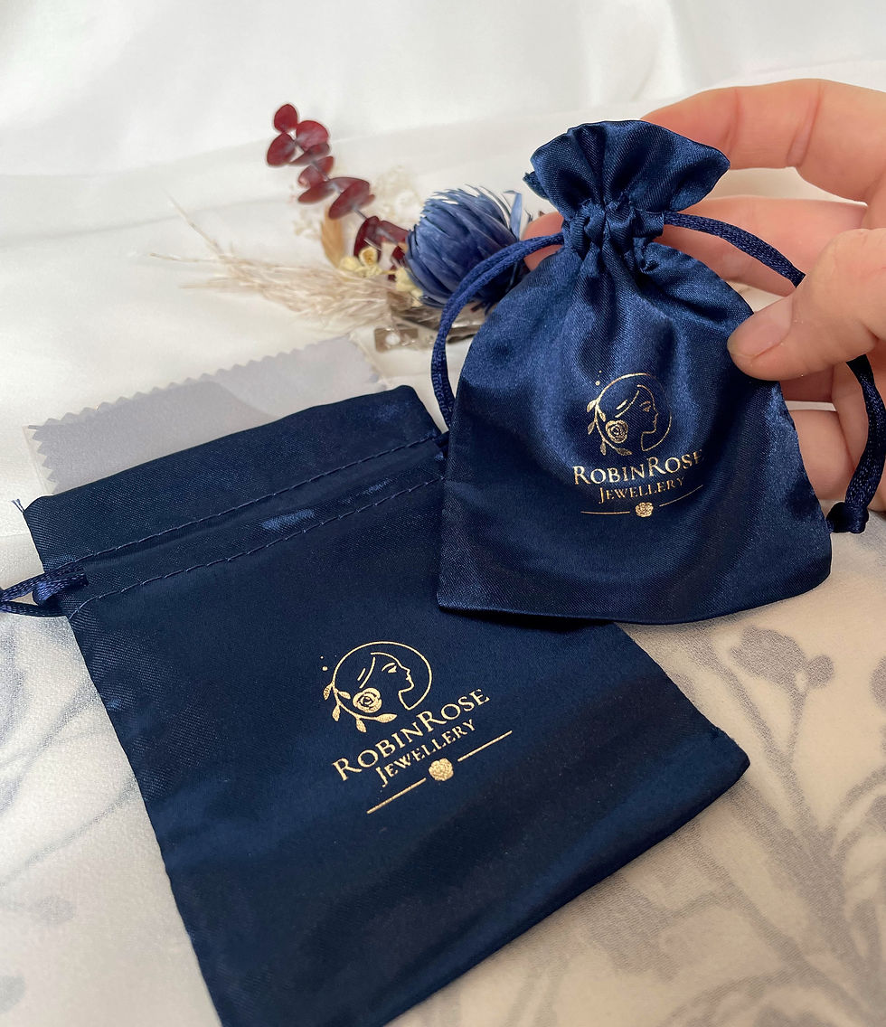 Thumbnail: Silver and 9ct Rose gold accent bangle, interlocking, gold detail. 