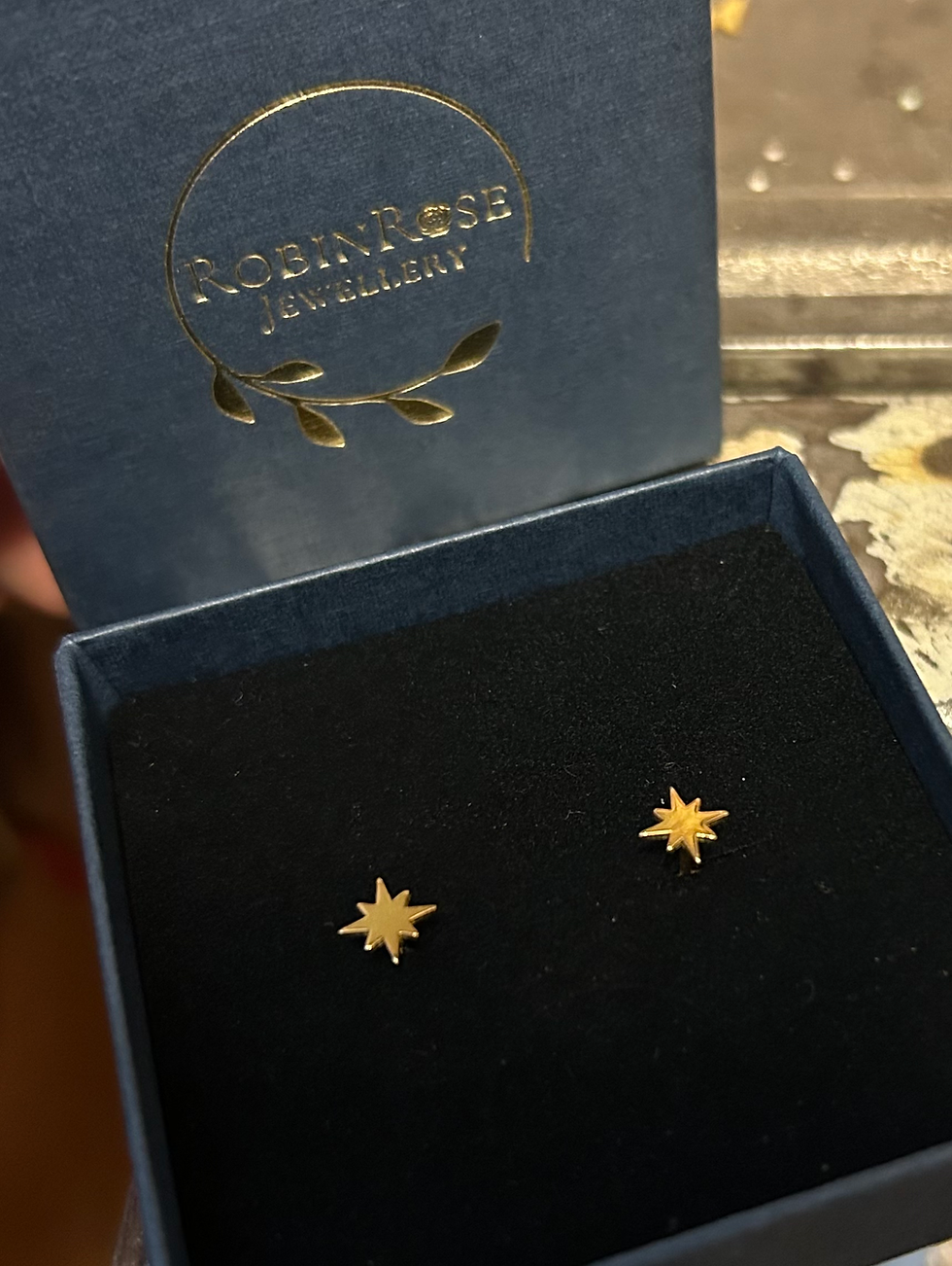 Thumbnail: Gold pole star studs 8 point star earrings 