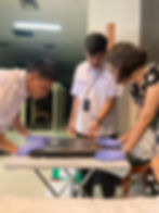 Team members digitising a historic object as part of the Indonesian Museums Documentation Project.