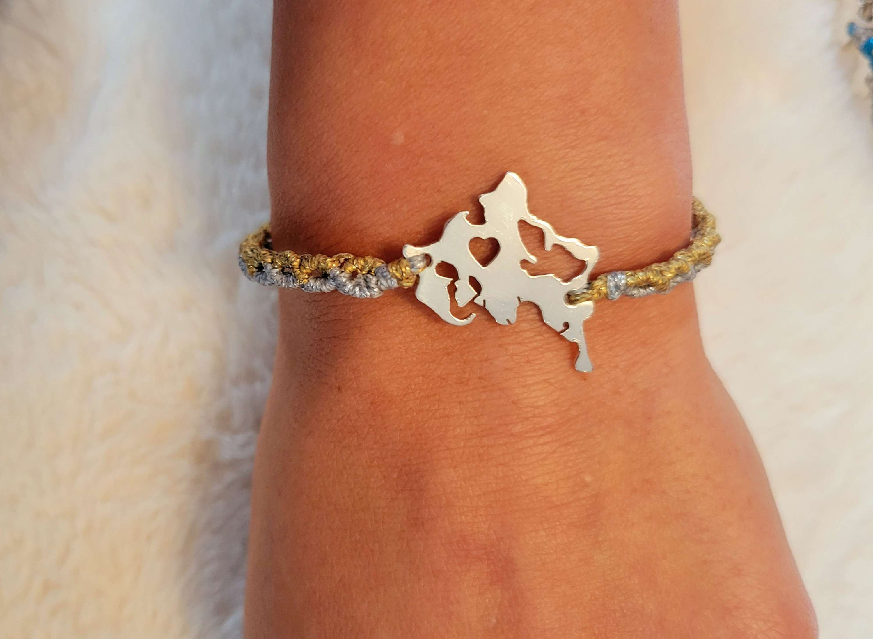 Macrame bracelet with sterling silver charm 
