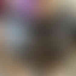 A black cauldron decorated with spirit board design