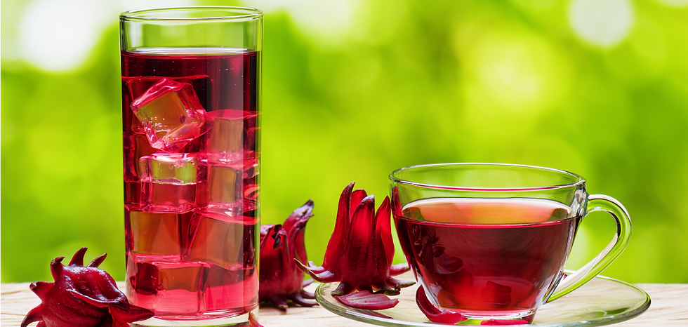 A glass of chilled hibiscus tea next to a cup of warm hibiscus tea.