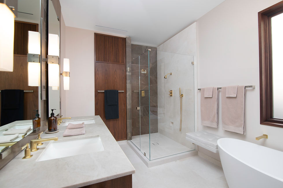 Larkspur, CA custom bathroom with marble shower and floor, slipper tub, walnut paneling and marble-topped vanity.