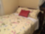 Yellow bedroom with double bed