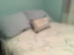Green bedroom with double bed