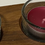 Thumbnail: Two candles in glass holders on wooden tray