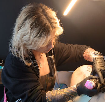 essie bloom tattooing woman