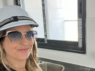 Ari Isaac, interior designer and project manager in a hard hat - Living by Ari.