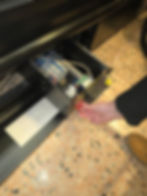 Hand opening a machine drawer in the gallery