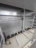 Empty metal refrigerator gallery display shelves