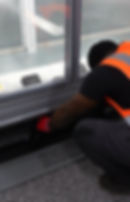 Technician maintaining a commercial gallery refrigerator