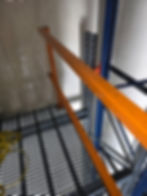 Industrial shelving and safety railing in a warehouse gallery