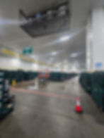 Large warehouse gallery with stacked crates and lift