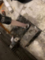 Vacuum hose cleaning soot from a fireplace gallery