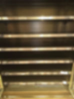 Empty shelves in a gallery display case