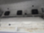 Refrigeration fans above ice buildup in a gallery unit.