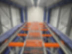 Industrial storage gallery featuring orange racking.