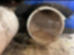 Clogged PVC pipe in a plumbing gallery