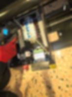 Electrician checking electrical panel in an image gallery