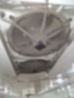 Industrial ceiling ventilation fans in a gallery.