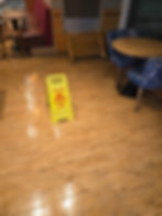 Yellow caution wet floor sign in a restaurant gallery