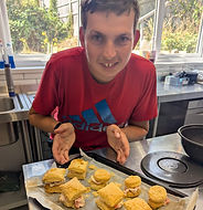 Person showing off what they have baked in the kitchen