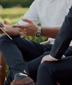 two businessmen having a meeting in the park _edited_edited_edited.jpg