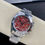 Thumbnail: Rolex Cosmograph Daytona with a red pomegranate, funa stone, a