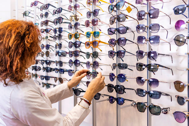 sunglass-shopping-red-haired-optometrist-trying-o-2026-01-08-07-45-58-utc.jpg