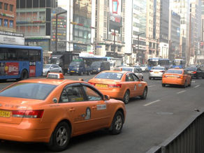 Korean Taxi driver burns himself to death outside National Assembly Building in protest against ride