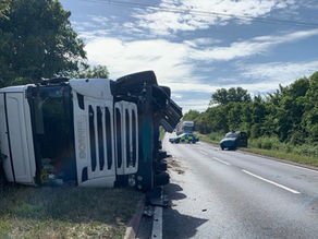 Lorry left on its side after road traffic collision with taxi in Essex