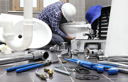 bigstock-Plumber-At-Work-In-A-Bathroom-2
