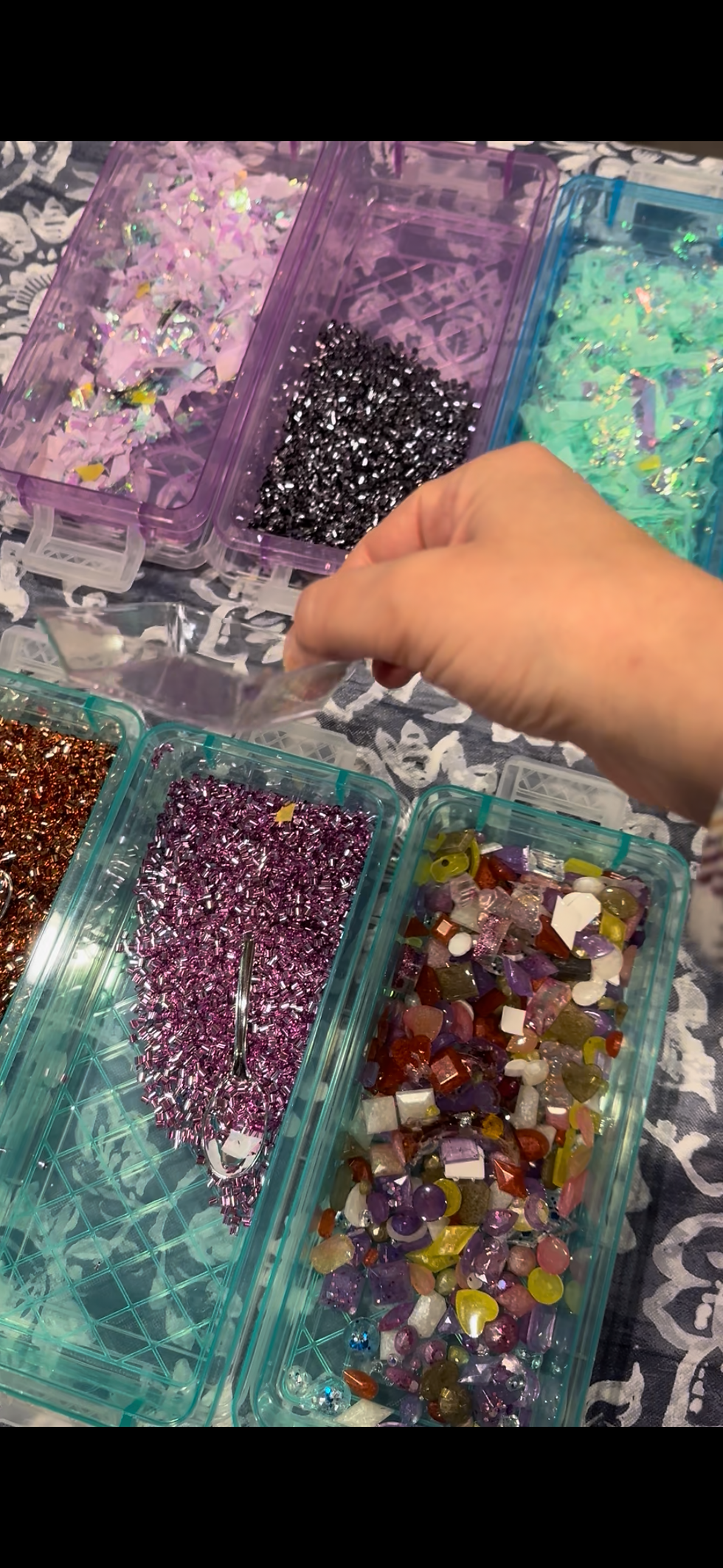 Glossy resin art in deep purple with metallic swirls from a Painting With Resin workshop”