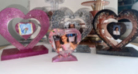 Resin art photo frame with clear pour and dried florals, displayed on matching stand