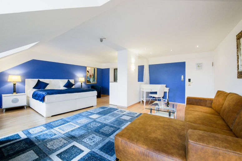 Modern hotel room in Munich with king-size bed and stylish interior in a central location.
