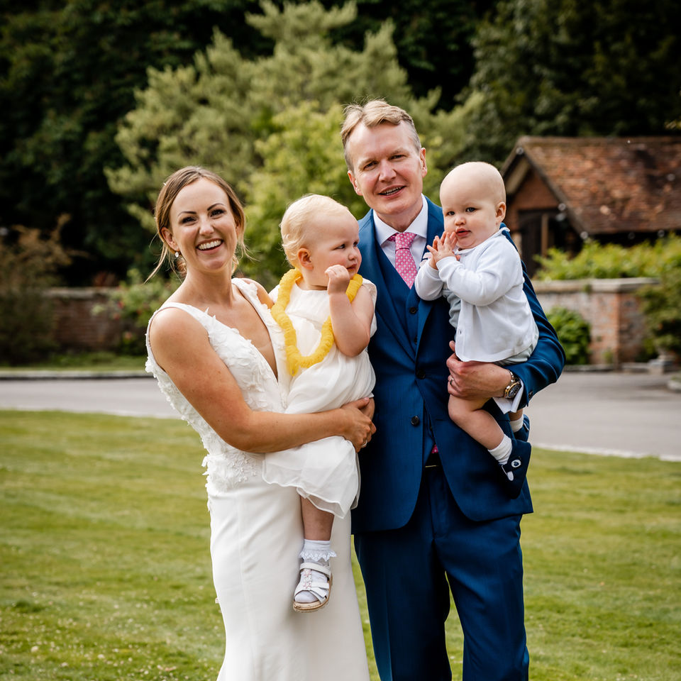 Libby and Jon on their wedding day with their children