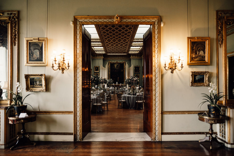 Entrance to wedding reception through the drawing room into the picture gallery at Somerley House 