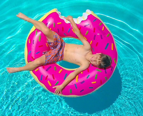 child in float in pool SQUARE 2023.jpg