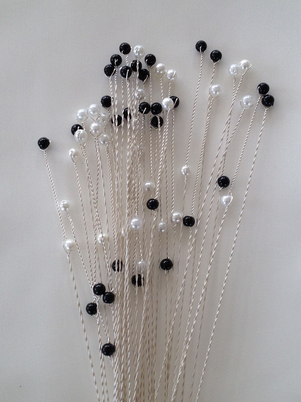 Thumbnail: Faux pearl and black plastic bead cake topper