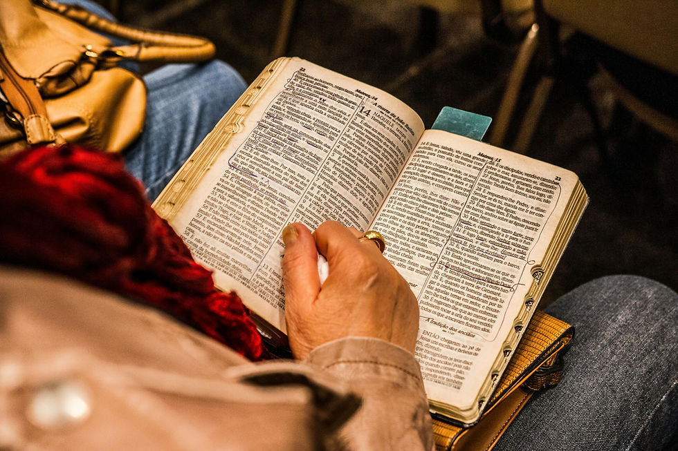 A man's hand on a Bible.