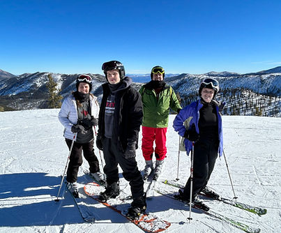 Jodi Wooten and her family enjoying a ski vacation in the snow-covered mountains of Switzerland.