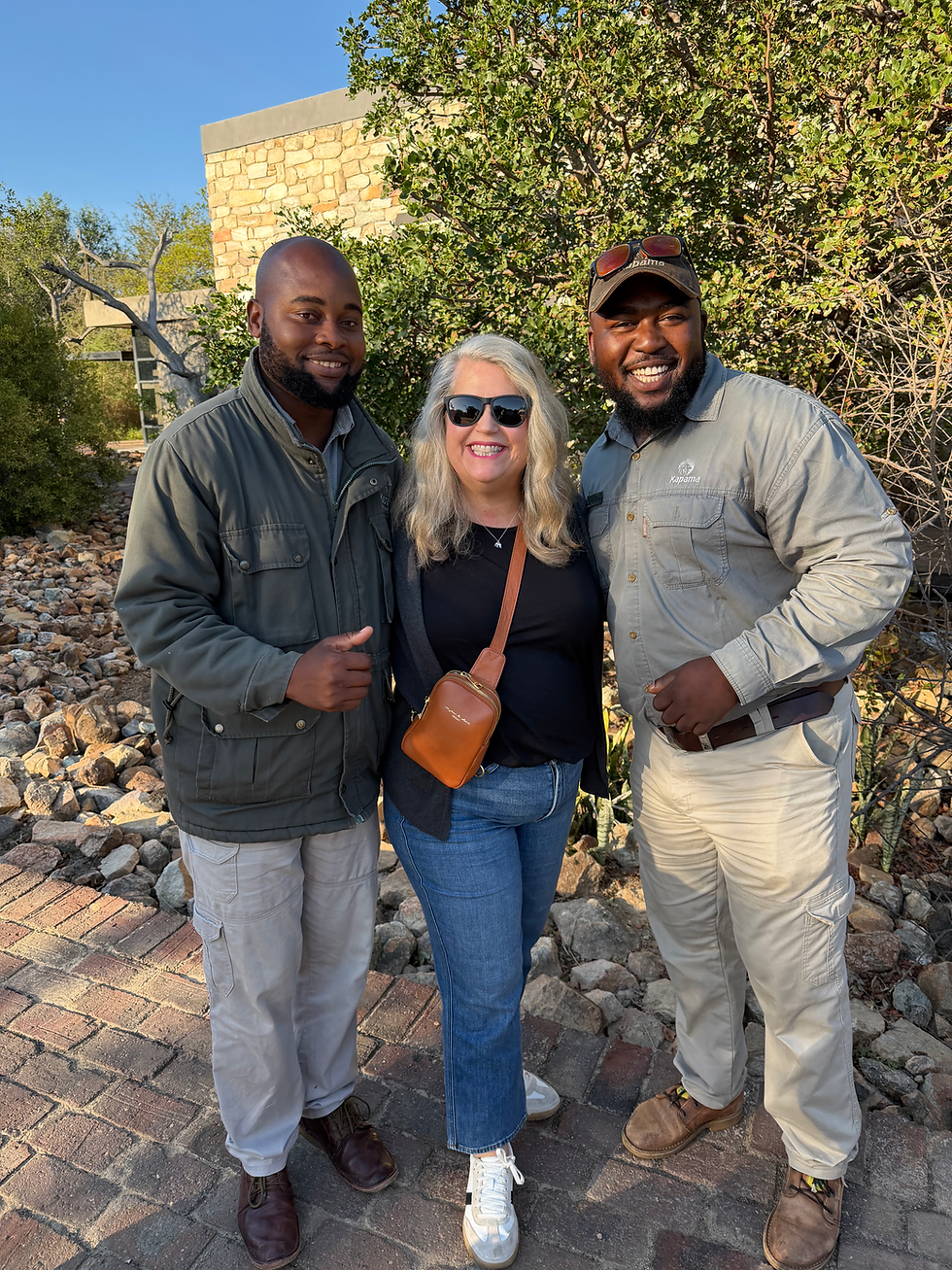 Travel advisor Jennifer Ormesher with a certified safari guide and tracker at a luxury safari lodge in South Africa