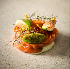 Lox with what appears to be slices of guava and fresh dill