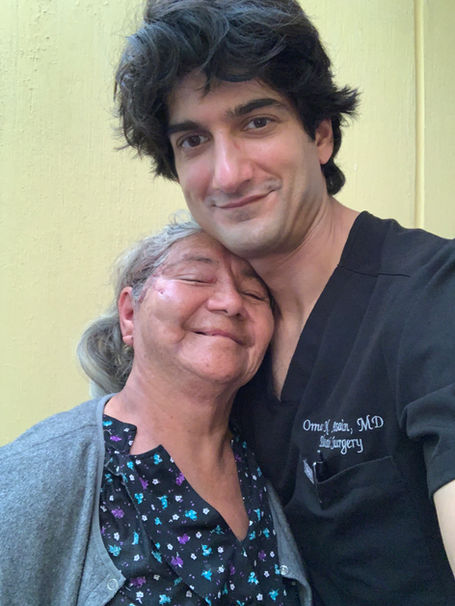 Dr Omar Hussain and patient 