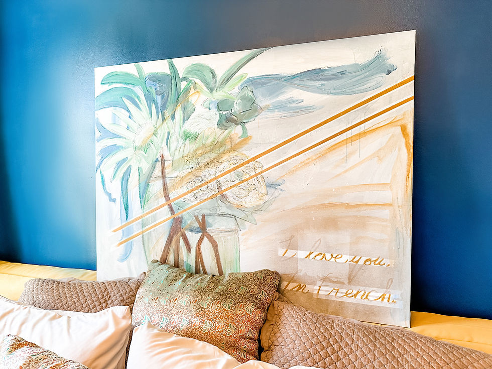 Finished painting on top of a headboard picture ledge.