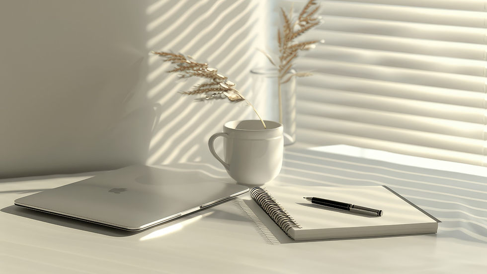 A Table with Laptop, A Coffee Mug and a Notebook with a Pen.