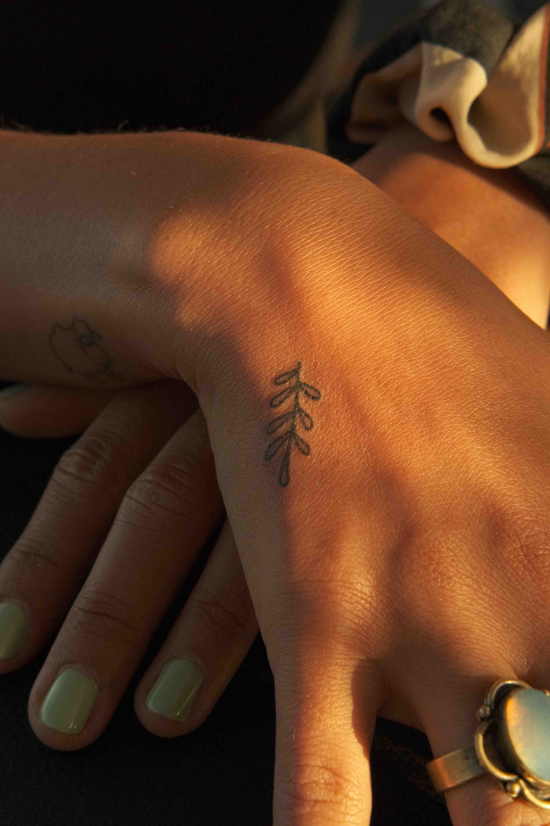 A minimalistic olive tattoo in linework style, created at Wake Park Lagos during the Hippie Market event. The design features clean, simple lines and was inked in Lagos, Portugal, within the beautiful Algarve region, near Sagres.