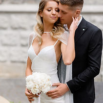 close-view-pretty-girl-fashionable-white-dress-accessories-holding-blooming-bouquet-closin
